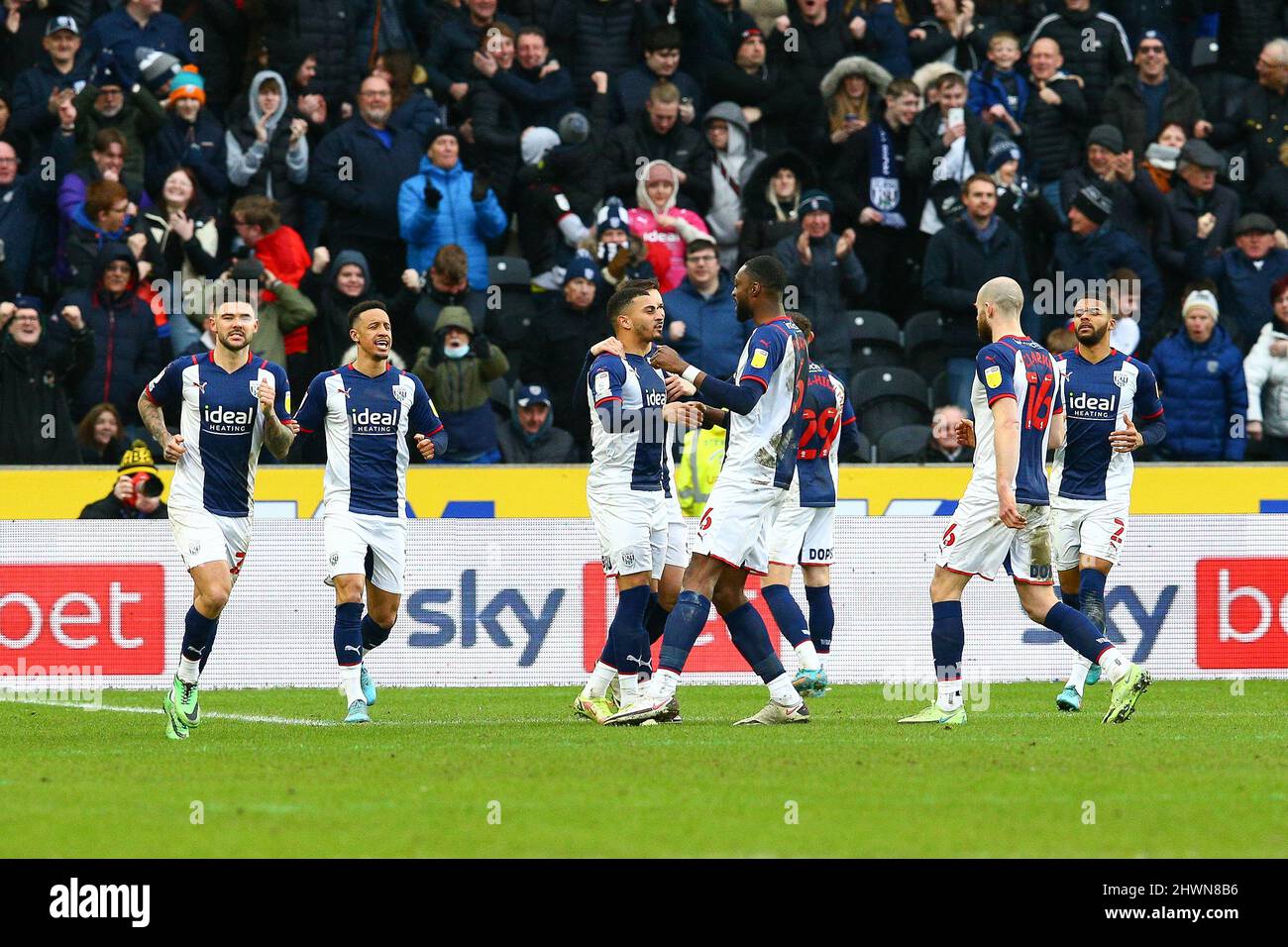 MKM Stadium, Hull, England - 5th March 2022  West Brom players mob Karlan Grant (middle) after he made it  0 - 2  during the game Hull City v West Bromwich Albion, EFL Championship 2021/22 MKM Stadium, Hull, England - 5th March 2022   Credit: Arthur Haigh/WhiteRosePhotos/Alamy Live News Stock Photo