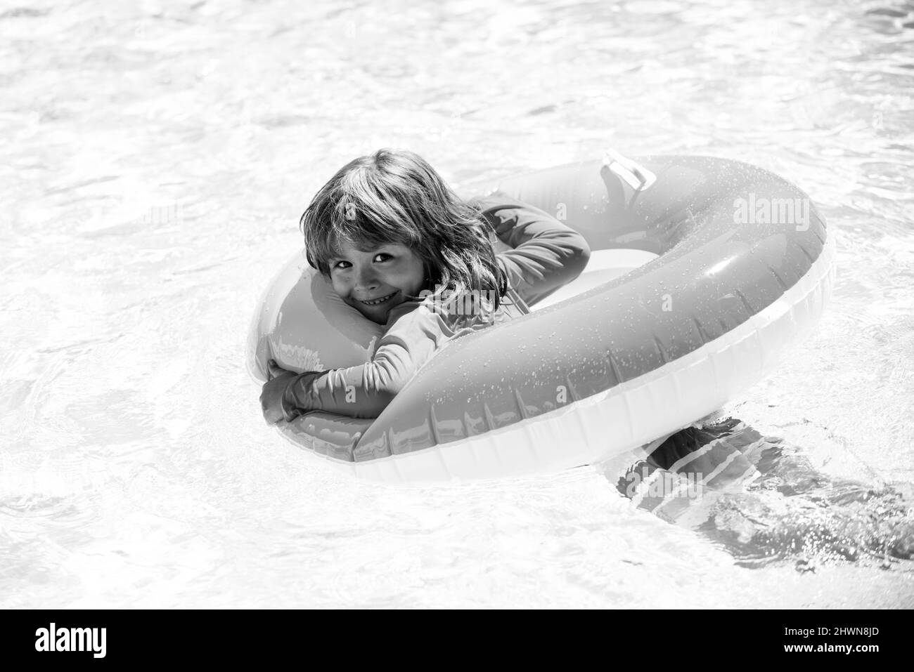 Child in summer pool. Summer kids vacation. Summertime child weekend