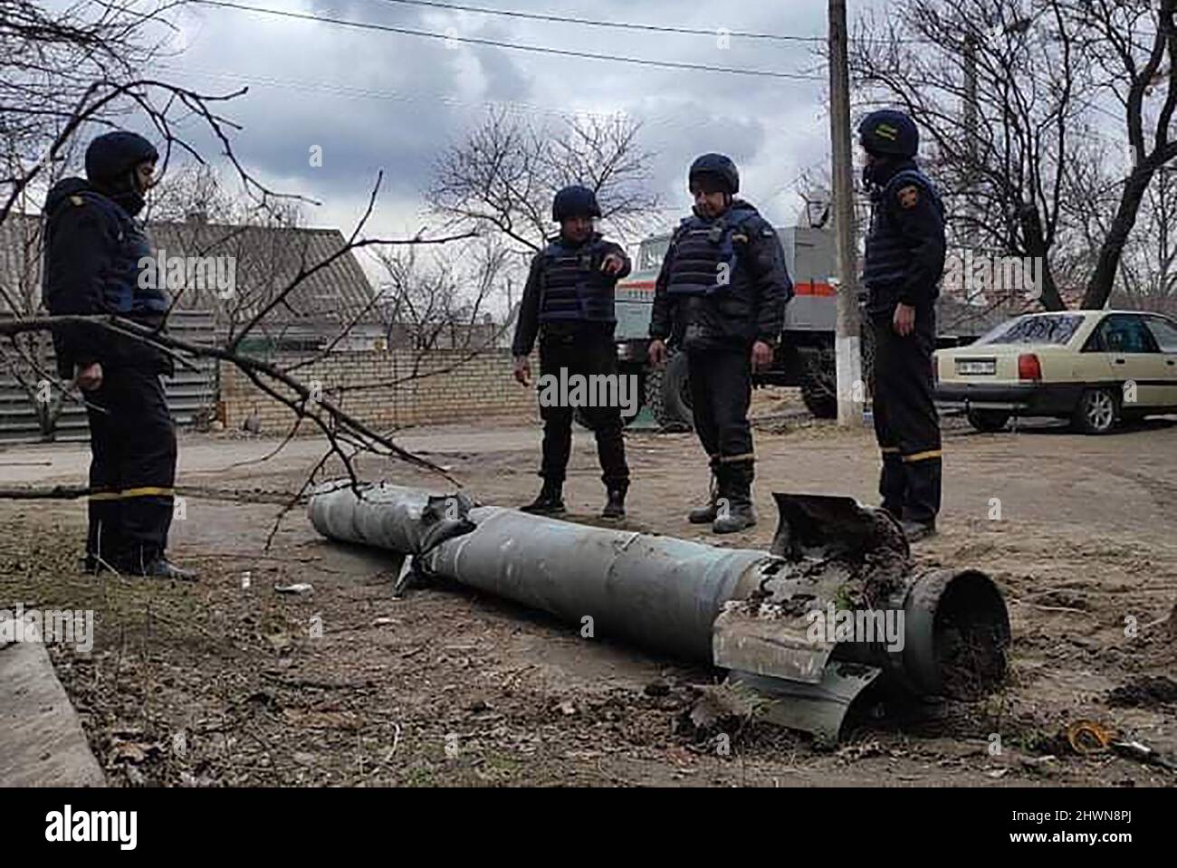 Mykolaiv, Ukraine. 06th Mar, 2022. Security personnel inspect the remains of a military weapon on a street Mykolaiv, southern Ukraine, on Sonday on March 6, 2022. photo by State Emergency Services Of Ukraine/ Credit: UPI/Alamy Live News Stock Photo