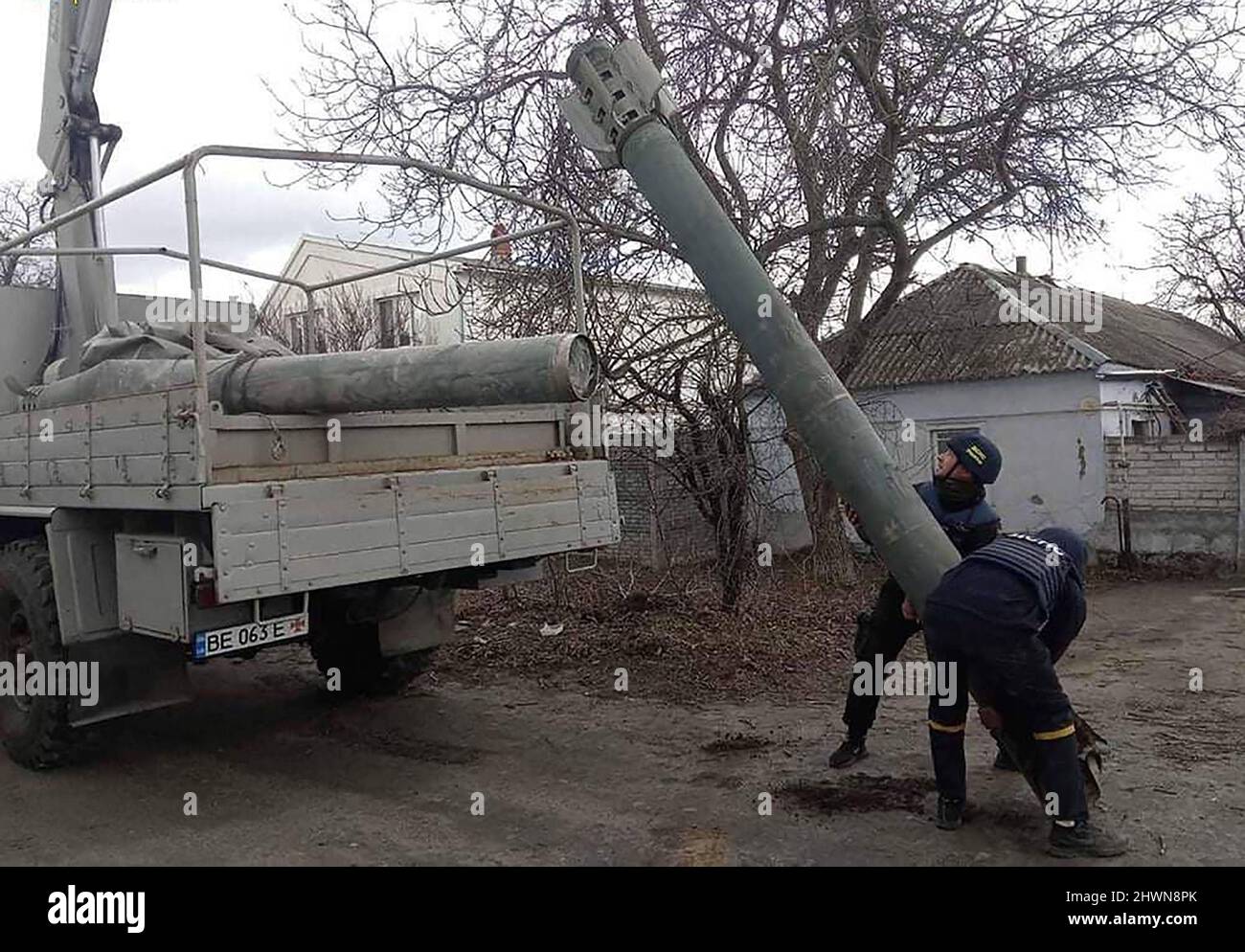 Mykolaiv, Ukraine. 06th Mar, 2022. Security personnel inspect the remains of a military weapon on a street Mykolaiv, southern Ukraine, on Sonday on March 6, 2022. photo by State Emergency Services Of Ukraine/ Credit: UPI/Alamy Live News Stock Photo