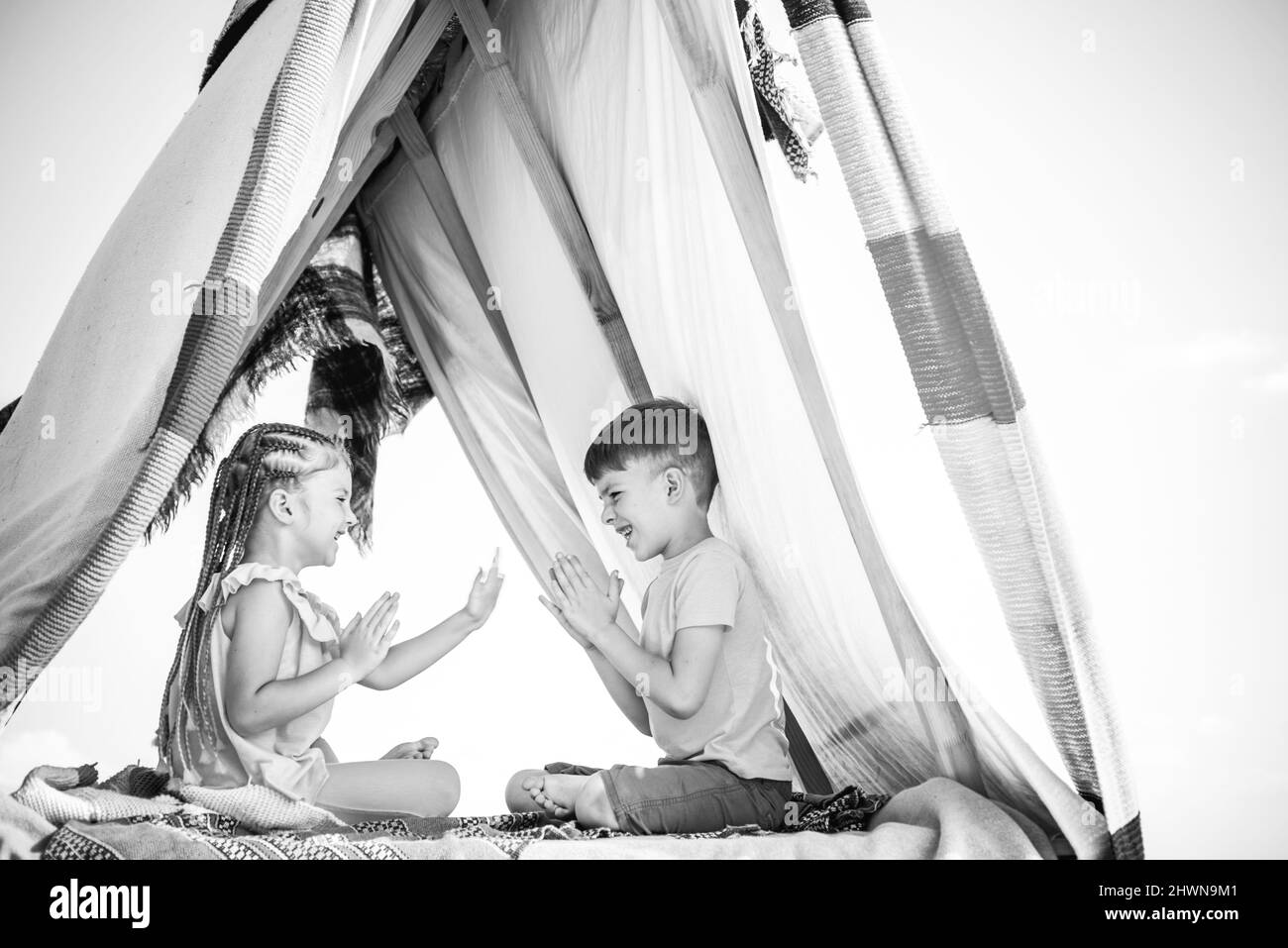 Backyard party. Happy childhood concept. Children adaptation. Summer weekend. Kids outdoor vacation. Stock Photo