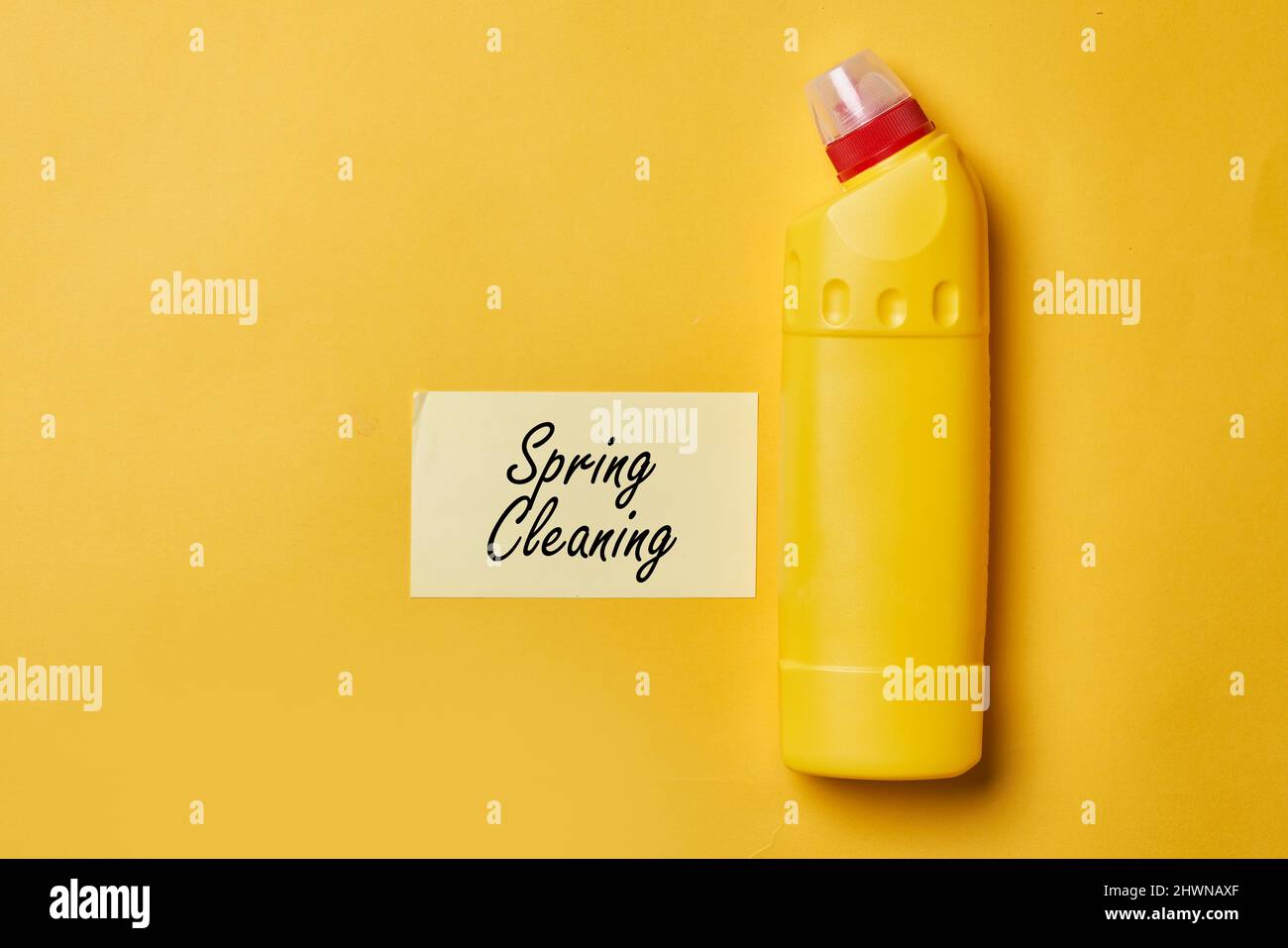 Cleaning service concept. Spring cleaning. Cleaning chemical bottles and supplies. House cleaning concept on colored background Stock Photo