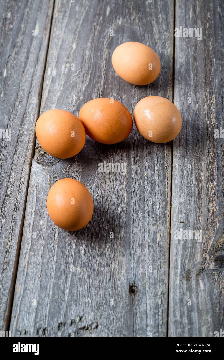 Chicken eggs on wooden table Stock Photo