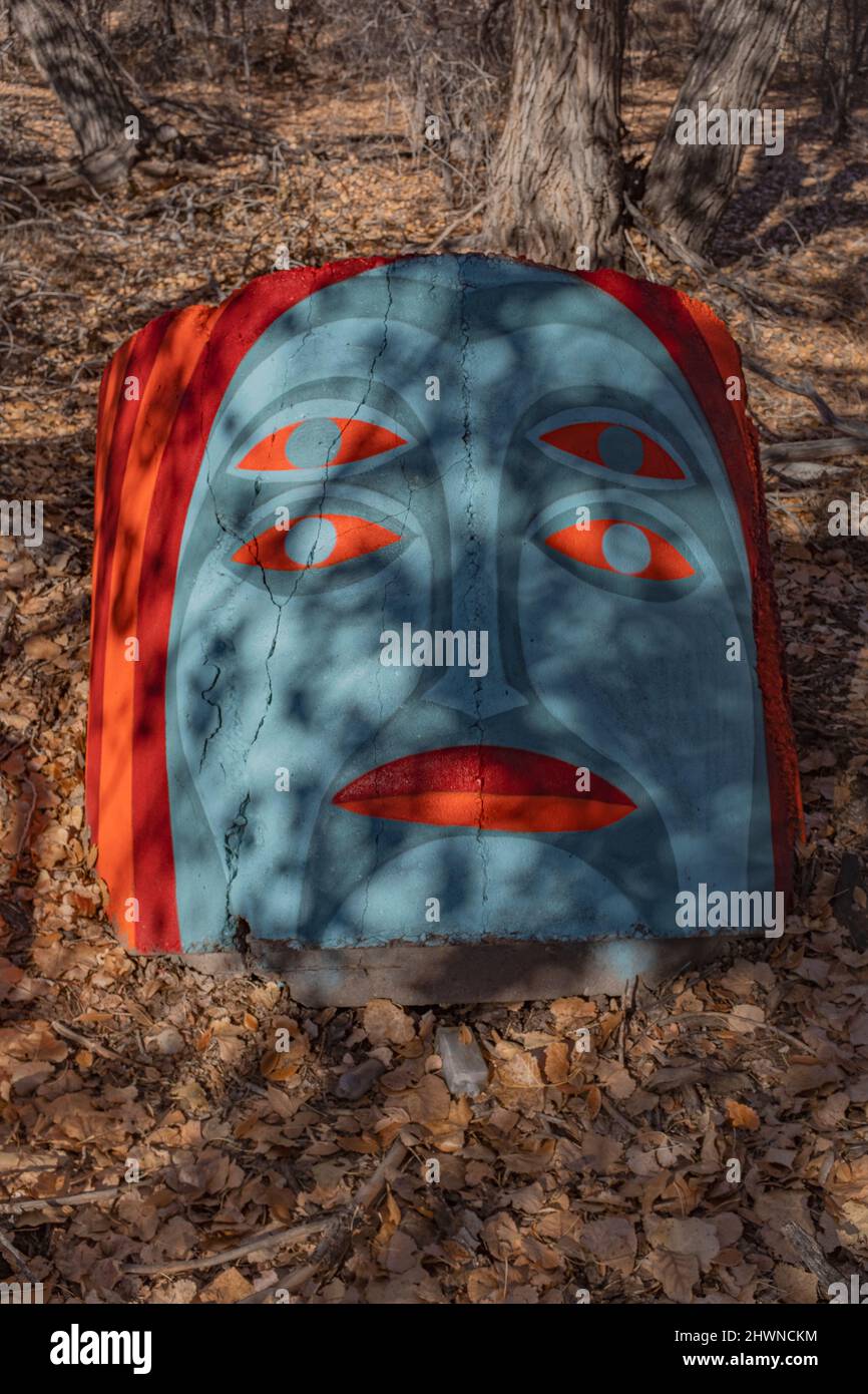 concrete conduit painted with face along Rio Grande bosque (river forest): Albuquerque, New Mexico Stock Photo