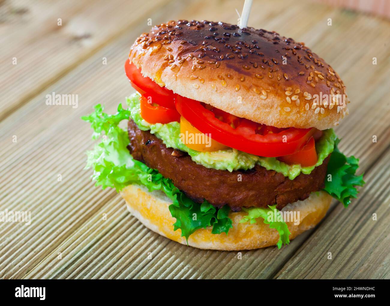 Vegetarian hamburger with soybean cutlet, tomato and lettuce Stock