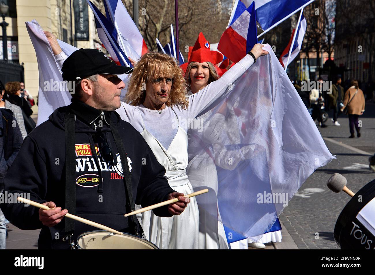 Marseille, France. 26th Feb, 2022. Women dressed as the ''Marianne'' with Phrygian caps hold French flags during the demonstration.Women dressed as the ''Marianne'' (symbol of freedom in France) demonstrate in Marseille against draconian measures such as the vaccination pass imposed by the French government. (Credit Image: © Gerard Bottino/SOPA Images via ZUMA Press Wire) Stock Photo