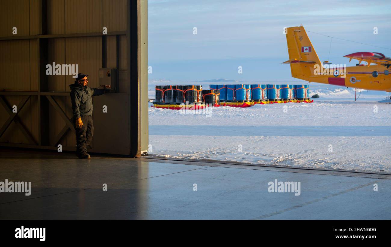 A civilian at Deadhorse Aviation Center East Hanger assists in preICEX