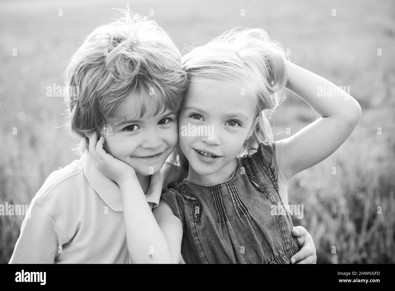 Childhood memories. Festive Art Greeting Card. Kids having fun in field against nature background. Valentines day cupid child. Child with angelic Stock Photo