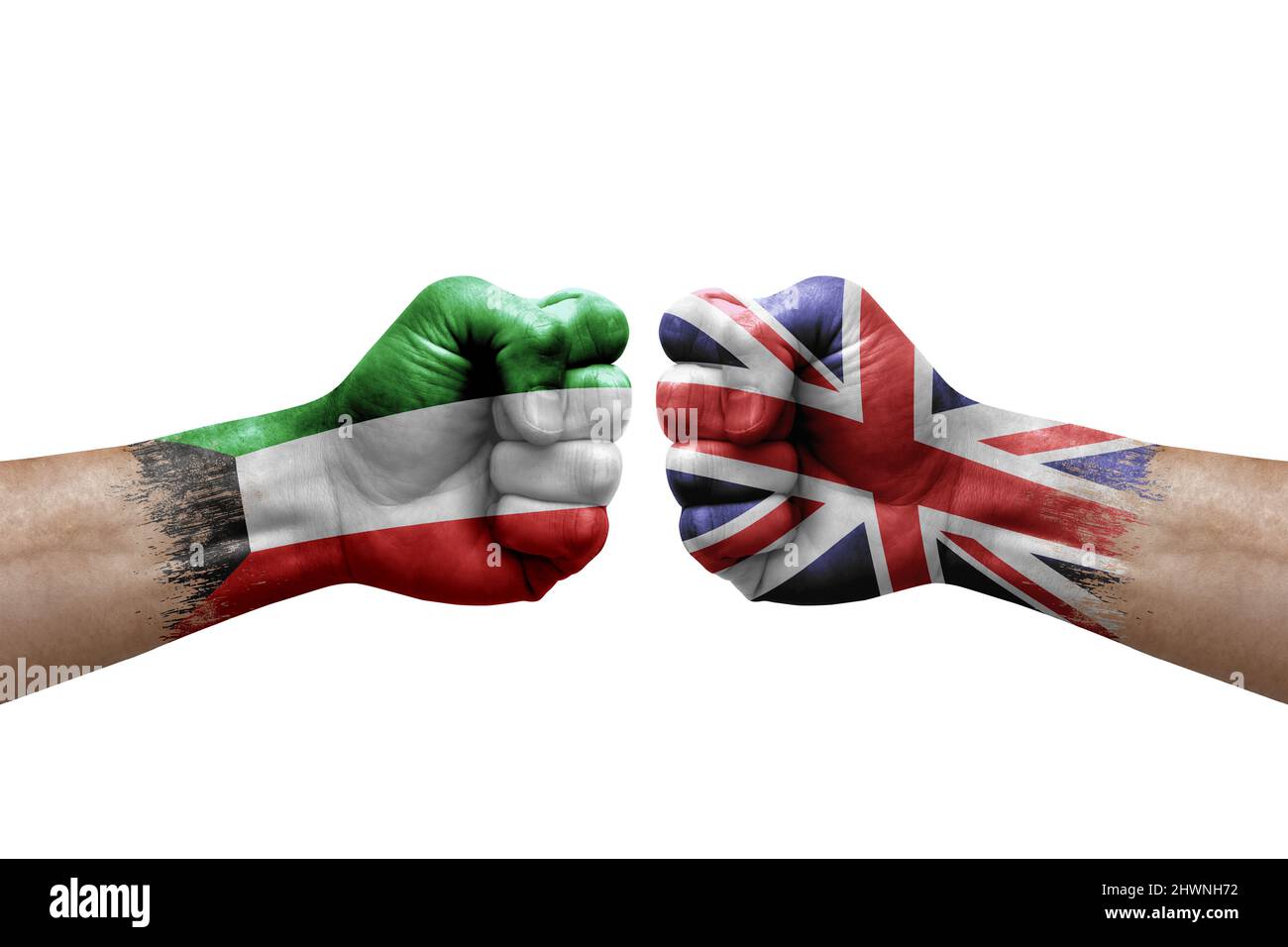 Two hands punch to each others on white background. Country flags painted fists, conflict crisis concept between kuwait and united kingdom Stock Photo