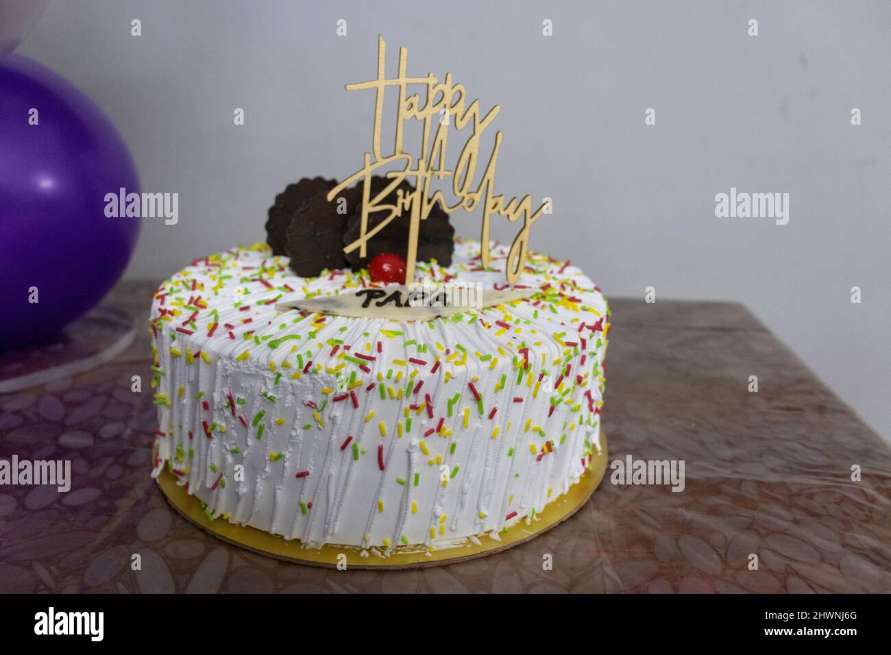 birthday white cake sparkle with colorful chocolate chips for father from different angle Stock Photo