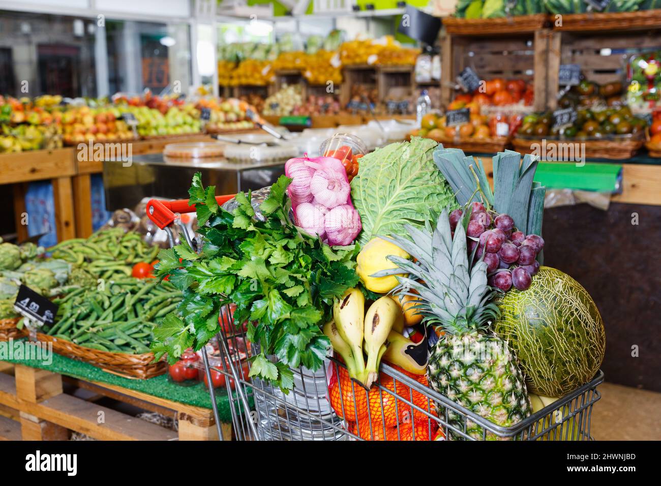 Vegetables and fruits in shopping cart in greengrocery Stock Photo - Alamy