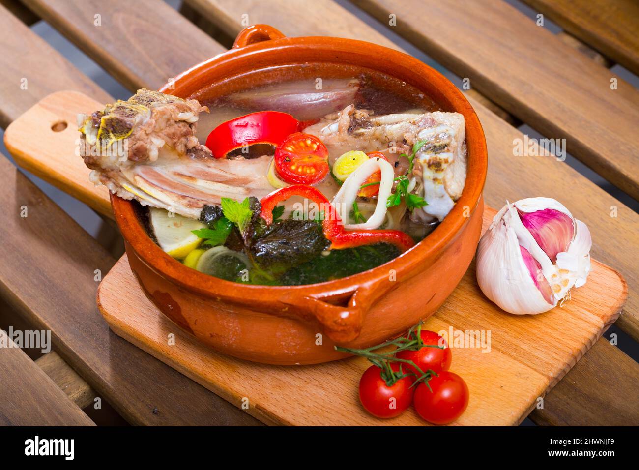 Lamb's soup cooked with vegetables, greens, onion and lemon, served in