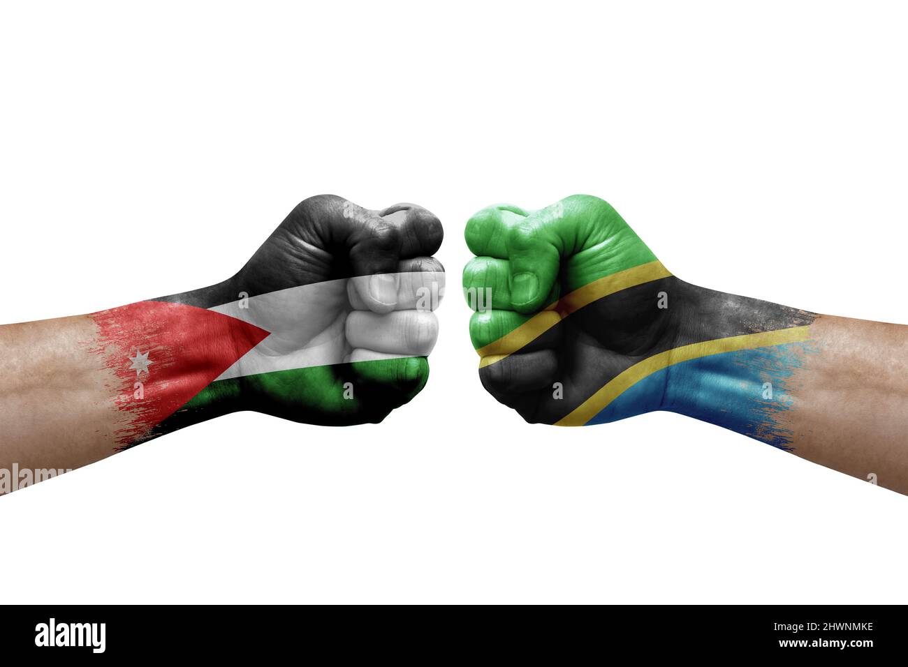 Two hands punch to each others on white background. Country flags painted fists, conflict crisis concept between jordan and tanzania Stock Photo