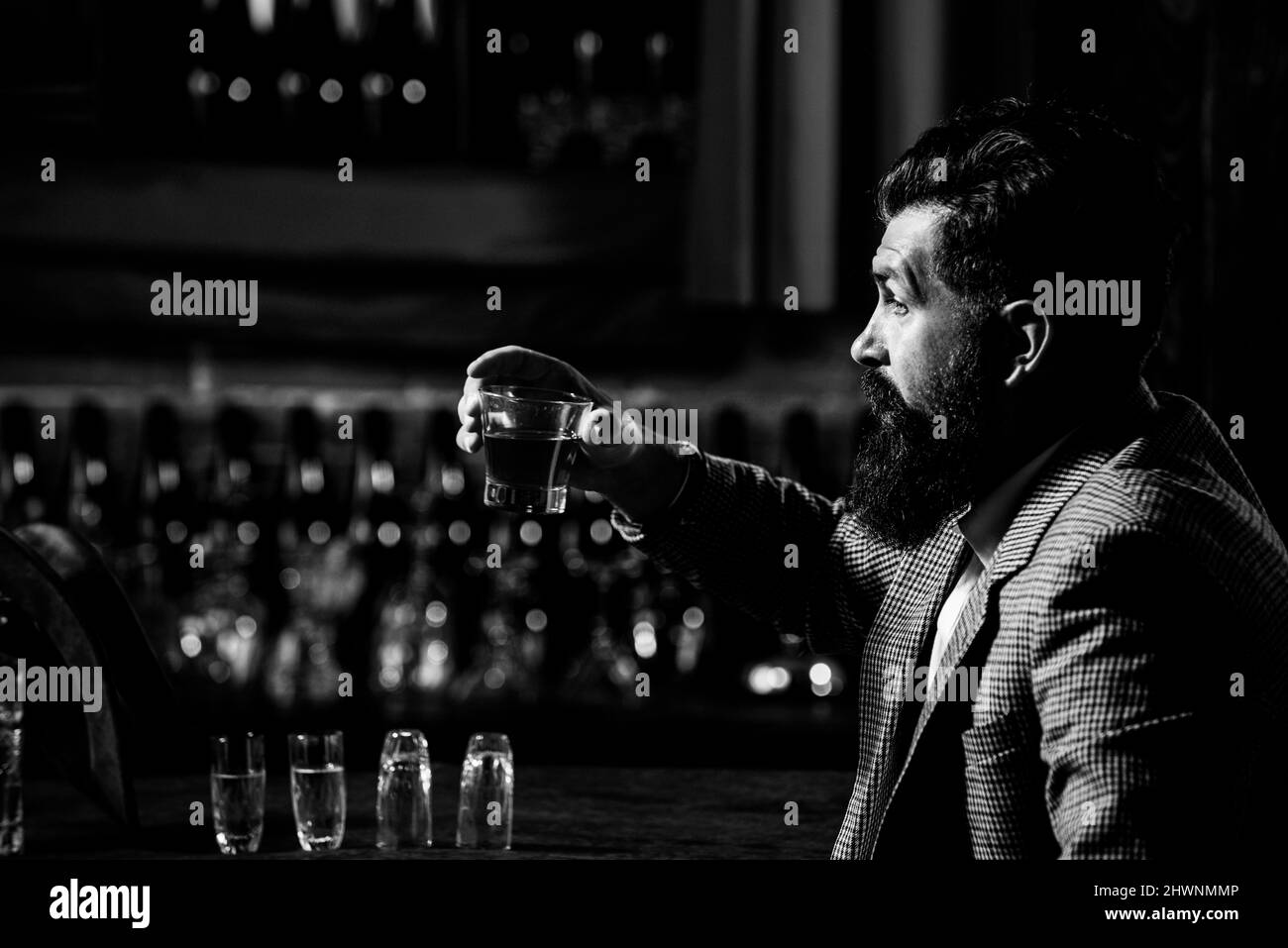Bearded gentleman drink cognac. Sipping finest whiskey. Stylish rich ...