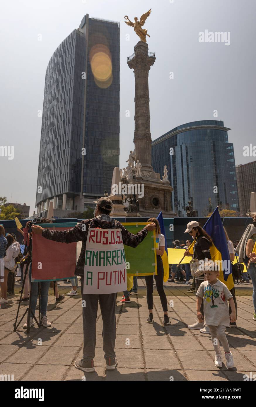 Anti-war protests in Mexico City Ukrainian supporters demonstration in Reforma Street. Flags, indignation and large group of people walking. Stock Photo