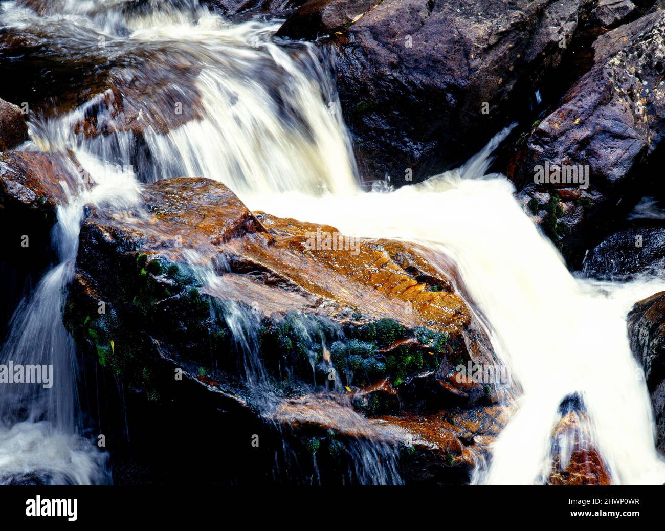 Fast Flowing Water over Rocks, Tasmania,  Australia Stock Photo