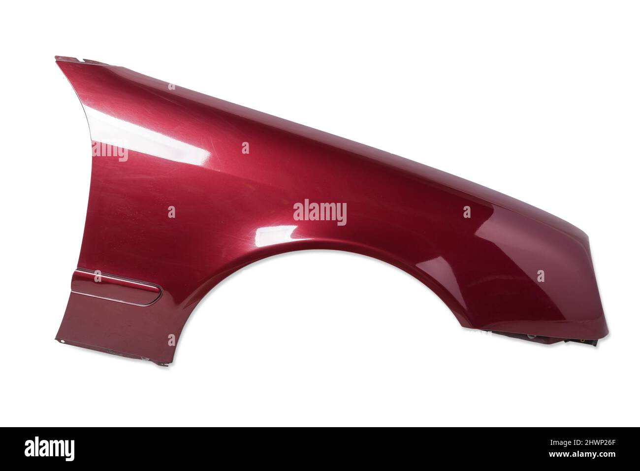 Red metallic fender on a white isolated background in a photo studio for sale or replacement in a car service. Mudguard on auto-parsing for repair or Stock Photo