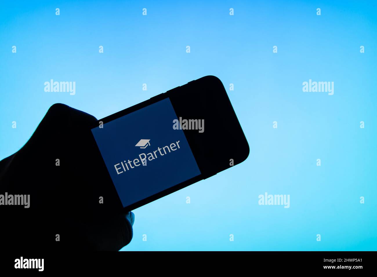 Rheinbach, Germany  4 March 2022,  The brand logo of the dating platform 'Elitepartner' on the display of a smartphone (focus on the brand logo) Stock Photo