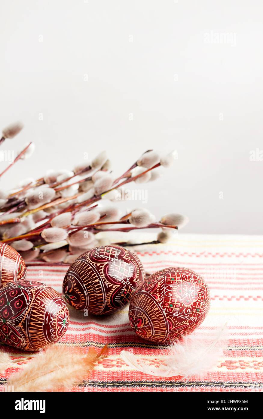 Easter still life with Pysanka on traditional Ukrainian cloth. Decorated Easter eggs, traditional for Eastern Europe culture. Copy space Stock Photo