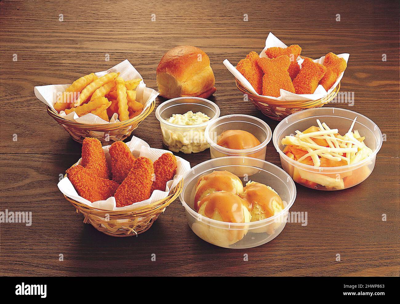 Assorted snacks with bread, chicken nuggets, french fries, mashed