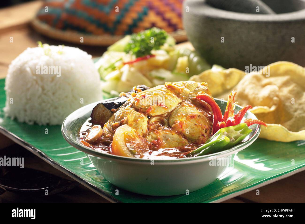 Traditional Indian dish of fish curry with okra and eggplant Stock Photo