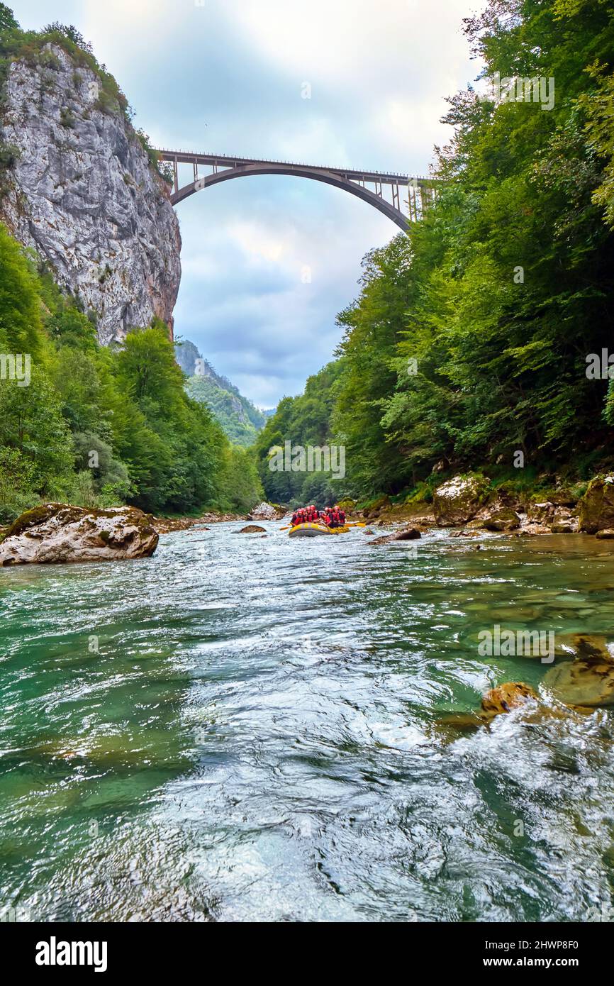 Rafting in Montenegro on the Tara River with a view of the Dzhurdzhevich Bridge. Stock Photo