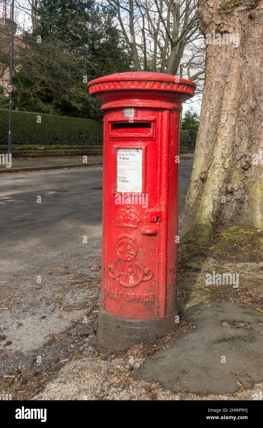 A King Edward VII royal mail pillar box in Roundhay, Leeds, England, UK Stock Photo