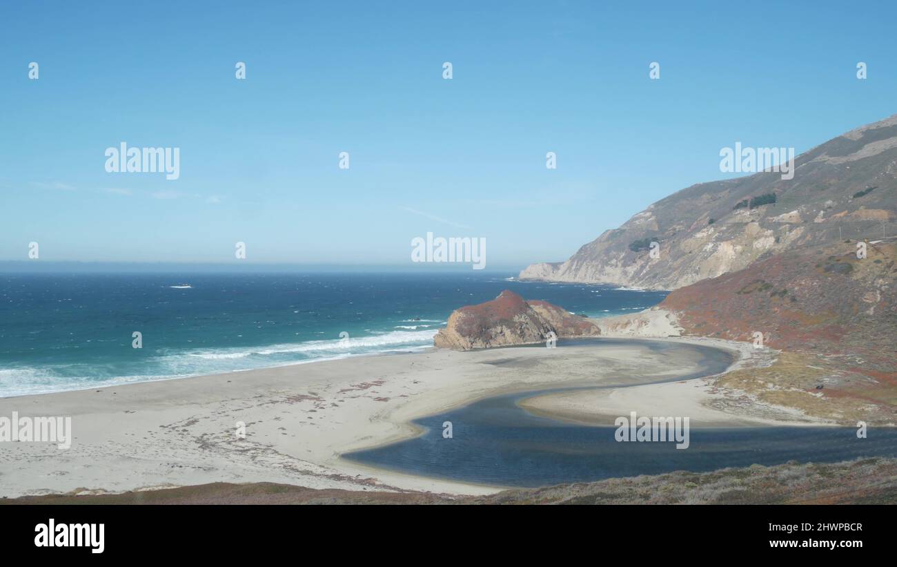 Little sur river beach on Pacific Coast Highway 1, scenic Cabrillo road. Estuary of river flowing to sea. Waves crashing on shore. Turning, winding, twisting creek. Big Sur landscape, California, USA. Stock Photo