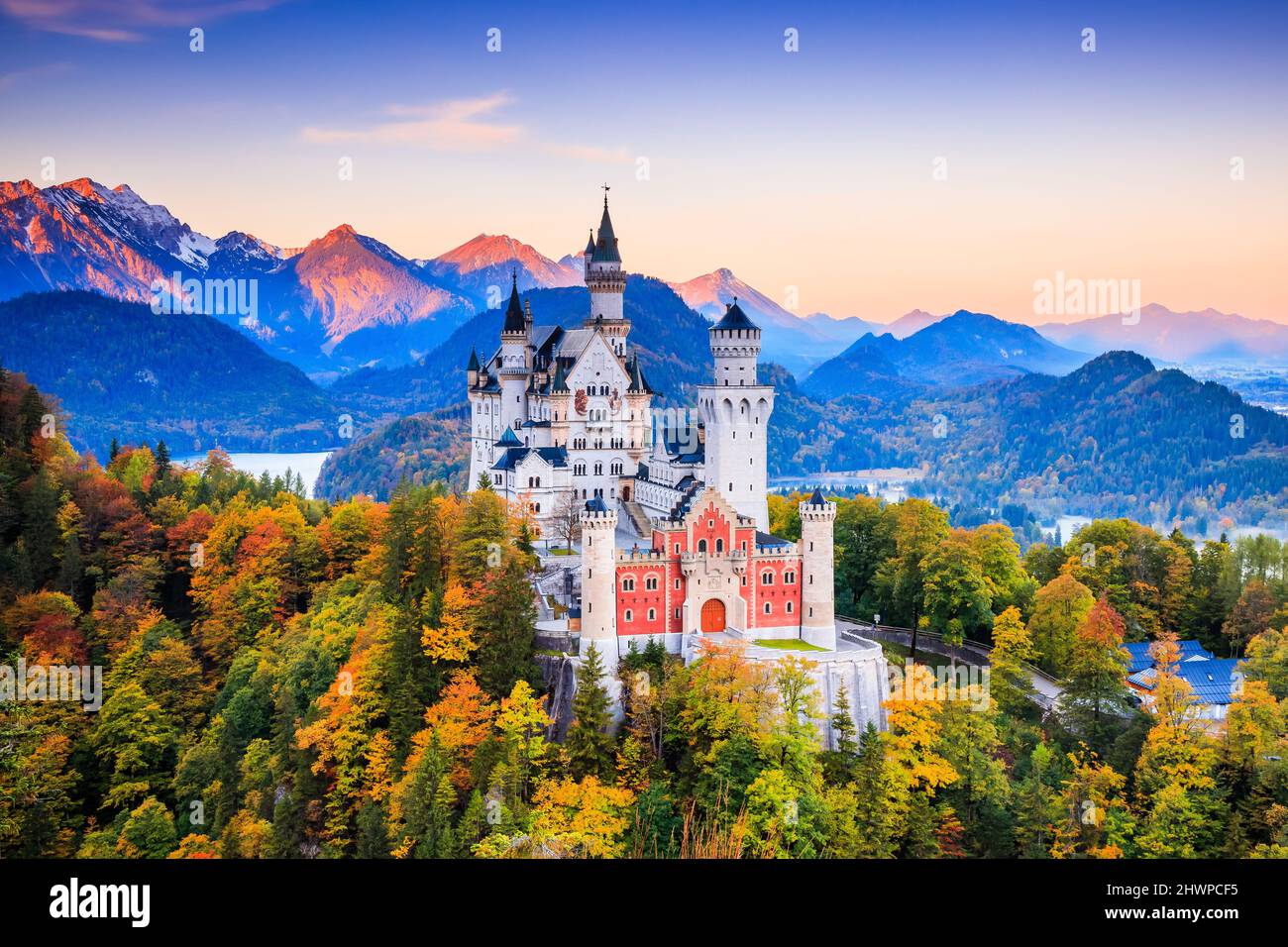 Neuschwanstein Castle (Schloss Neuschwanstein) Bavaria. Fussen, Germany. Front view of the castle at sunrise. The Bavarian Alps in the background. Stock Photo