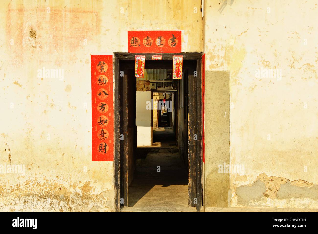 Hezhou, Hezhou, China. 7th Mar, 2022. A Hakka Round House in Rinchong Village, Liantang Town, Babu District, Hezhou City, Guangxi Province, taken on March 5.Jiang's ancestral house, located in Rinchong Village, Liantang Town, Babu District, Hezhou City, Guangxi Province, was built in the Qing Dynasty and has a history of more than 200 years. It is a typical Hakka Round House in East Guizhou. The Round House covers an area of more than 30 acres. The building is a square symmetrical structure, surrounded by a 3-meter-high wall and separated from the outside world. The layout of the buildings, Stock Photo