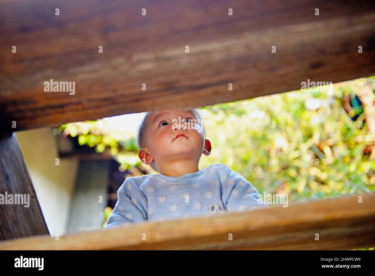 Hezhou, Hezhou, China. 7th Mar, 2022. On March 5, a young boy played in a Hakka Round House in Rinchong Village, Liantang Town, Babu District, Hezhou City.Jiang's ancestral house, located in Rinchong Village, Liantang Town, Babu District, Hezhou City, Guangxi Province, was built in the Qing Dynasty and has a history of more than 200 years. It is a typical Hakka Round House in East Guizhou. The Round House covers an area of more than 30 acres. The building is a square symmetrical structure, surrounded by a 3-meter-high wall and separated from the outside world. The layout of the buildings, ha Stock Photo