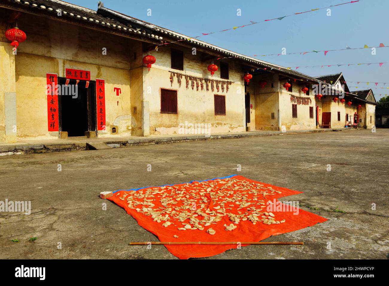 Hezhou, Hezhou, China. 7th Mar, 2022. A Hakka Round House in Rinchong Village, Liantang Town, Babu District, Hezhou City, Guangxi Province, taken on March 5.Jiang's ancestral house, located in Rinchong Village, Liantang Town, Babu District, Hezhou City, Guangxi Province, was built in the Qing Dynasty and has a history of more than 200 years. It is a typical Hakka Round House in East Guizhou. The Round House covers an area of more than 30 acres. The building is a square symmetrical structure, surrounded by a 3-meter-high wall and separated from the outside world. The layout of the buildings, Stock Photo