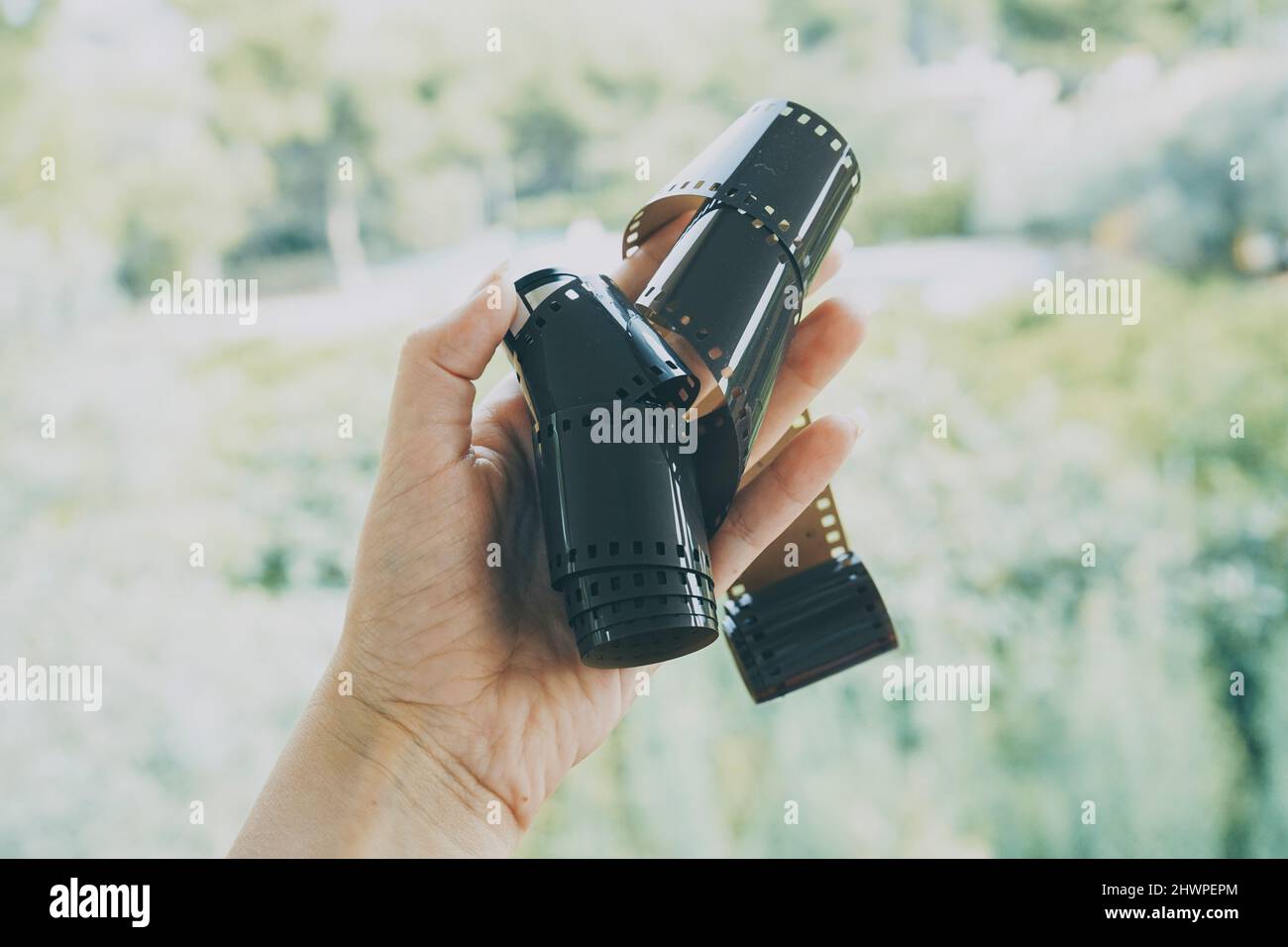 Hand olding a foggy photography film roll Stock Photo - Alamy