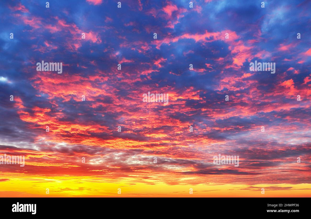 Sky at color sunset with orange red clouds Stock Photo
