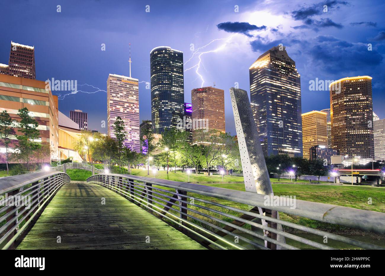 Houston Texas modern skyline at sunset twilight from park lawn Stock