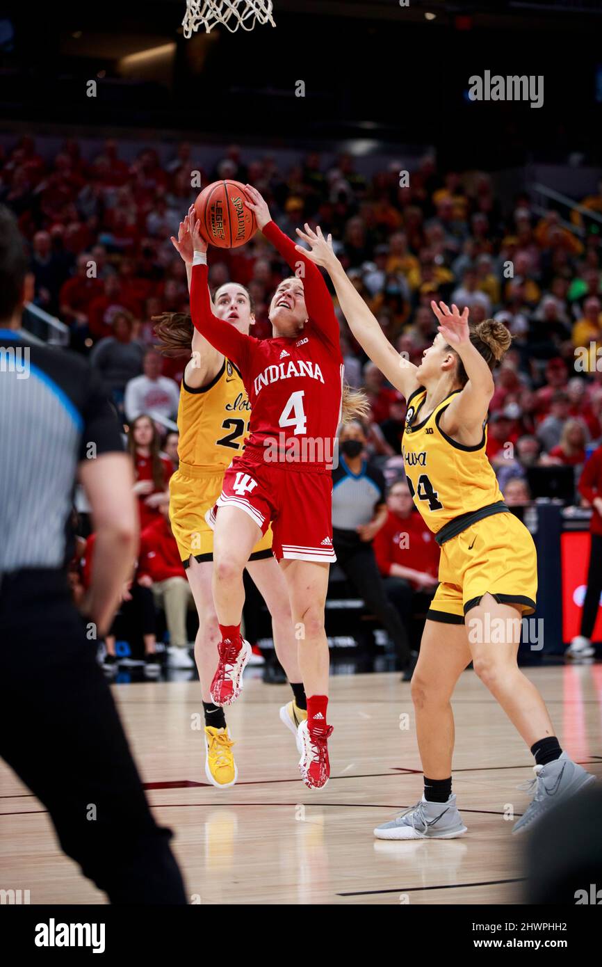 Indianapolis, United States. 06th Mar, 2022. Indiana Hoosiers guard Nicole Cardano-Hillary (4) plays against Iowa Hawkeyes guard Caitlin Clark (22) during the NCAA basketball Women's Big Ten Tournament game in Indianapolis. Iowa beat Indiana University 74-67. (Photo by Jeremy Hogan/SOPA Images/Sipa USA) Credit: Sipa USA/Alamy Live News Stock Photo