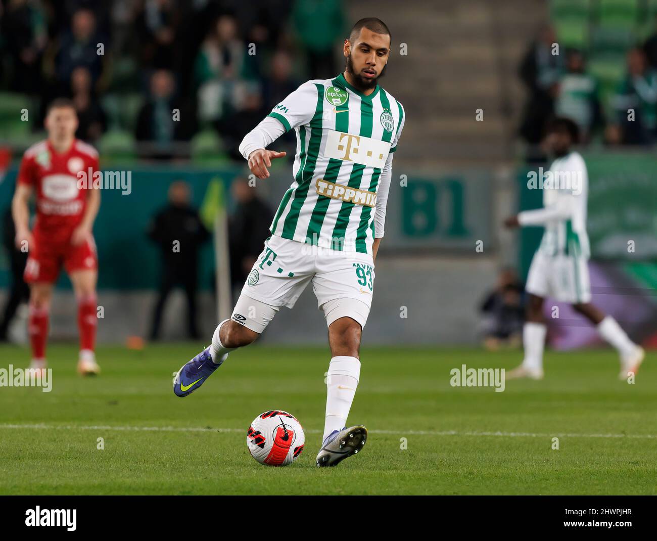 BUDAPEST, HUNGARY - MARCH 6: Claudiu Bumba of Kisvarda Master Good  challenges Henry Wingo of Ferencvarosi TC during the Hungarian OTP Bank  Liga match between Ferencvarosi TC and Kisvarda Master Good at