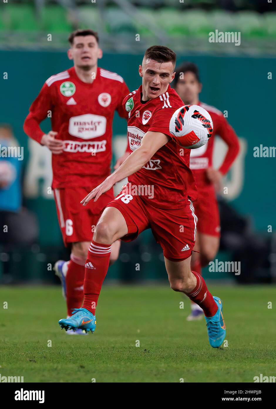 BUDAPEST, HUNGARY - MARCH 6: Claudiu Bumba of Kisvarda Master Good  challenges Henry Wingo of Ferencvarosi TC during the Hungarian OTP Bank  Liga match between Ferencvarosi TC and Kisvarda Master Good at