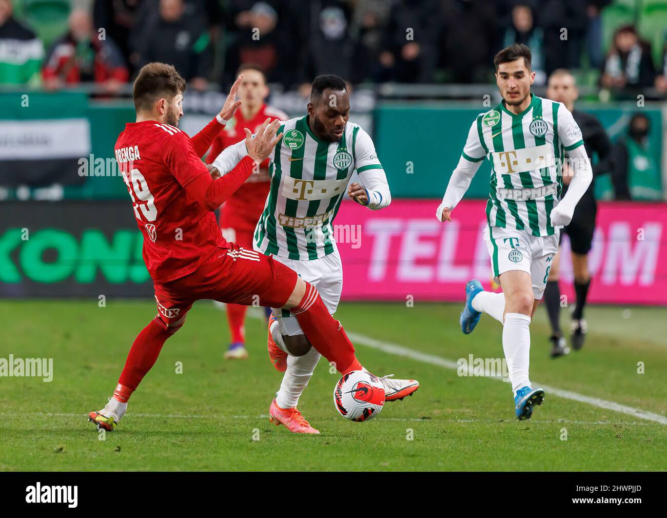 BUDAPEST, HUNGARY - MARCH 6: Claudiu Bumba of Kisvarda Master Good  challenges Henry Wingo of Ferencvarosi TC during the Hungarian OTP Bank  Liga match between Ferencvarosi TC and Kisvarda Master Good at