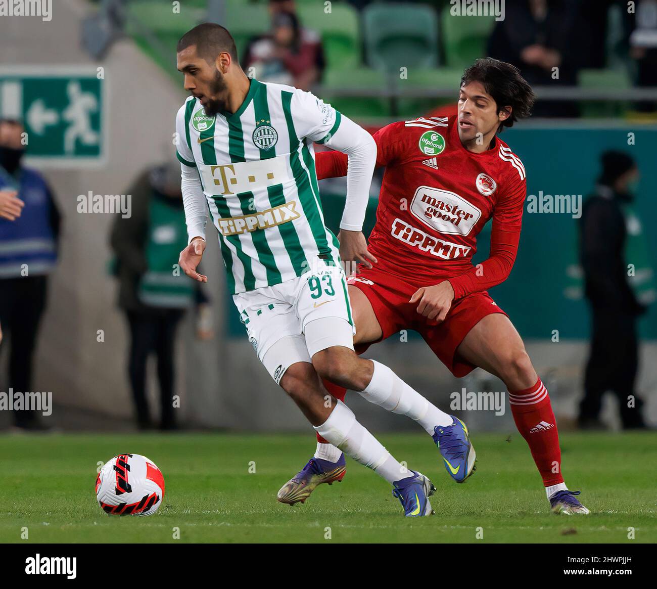 BUDAPEST, HUNGARY - MARCH 6: Claudiu Bumba of Kisvarda Master Good  challenges Henry Wingo of Ferencvarosi TC during the Hungarian OTP Bank  Liga match between Ferencvarosi TC and Kisvarda Master Good at