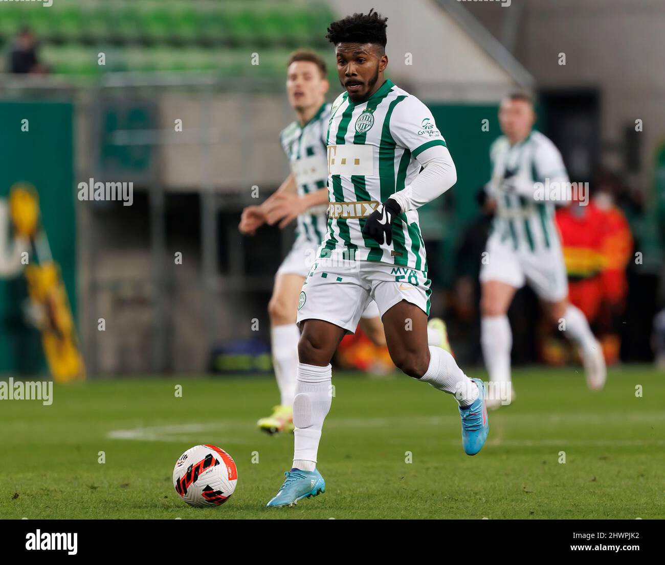 Petrus Boumal of Ujpest FC competes for the ball with Jose Marcos