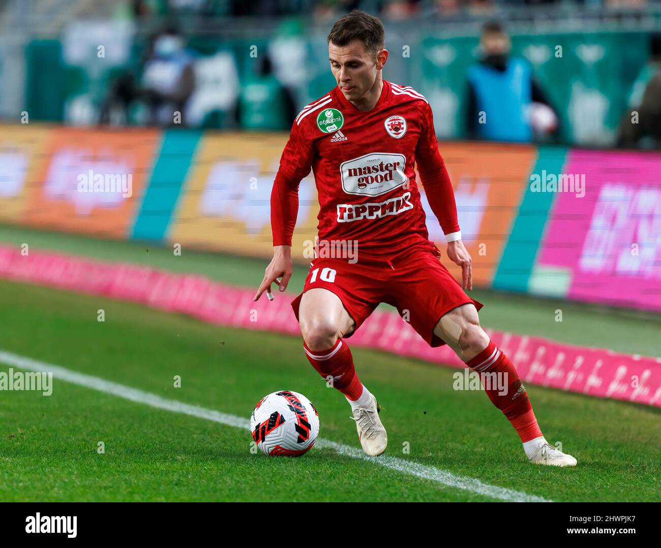 Claudiu Bumba of Kisvarda Master Good passes the ball in front of