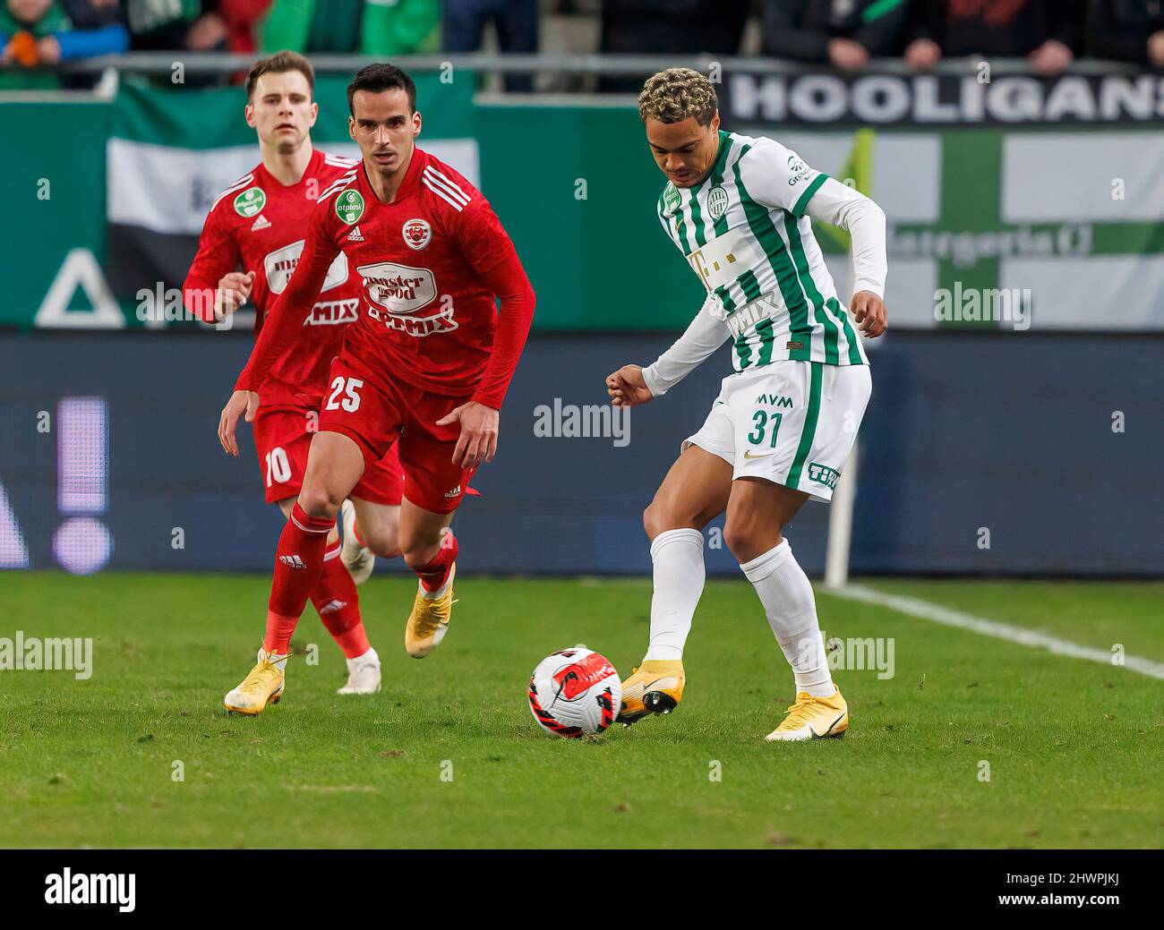 BUDAPEST, HUNGARY - MARCH 6: Claudiu Bumba of Kisvarda Master Good  challenges Henry Wingo of Ferencvarosi TC during the Hungarian OTP Bank  Liga match between Ferencvarosi TC and Kisvarda Master Good at