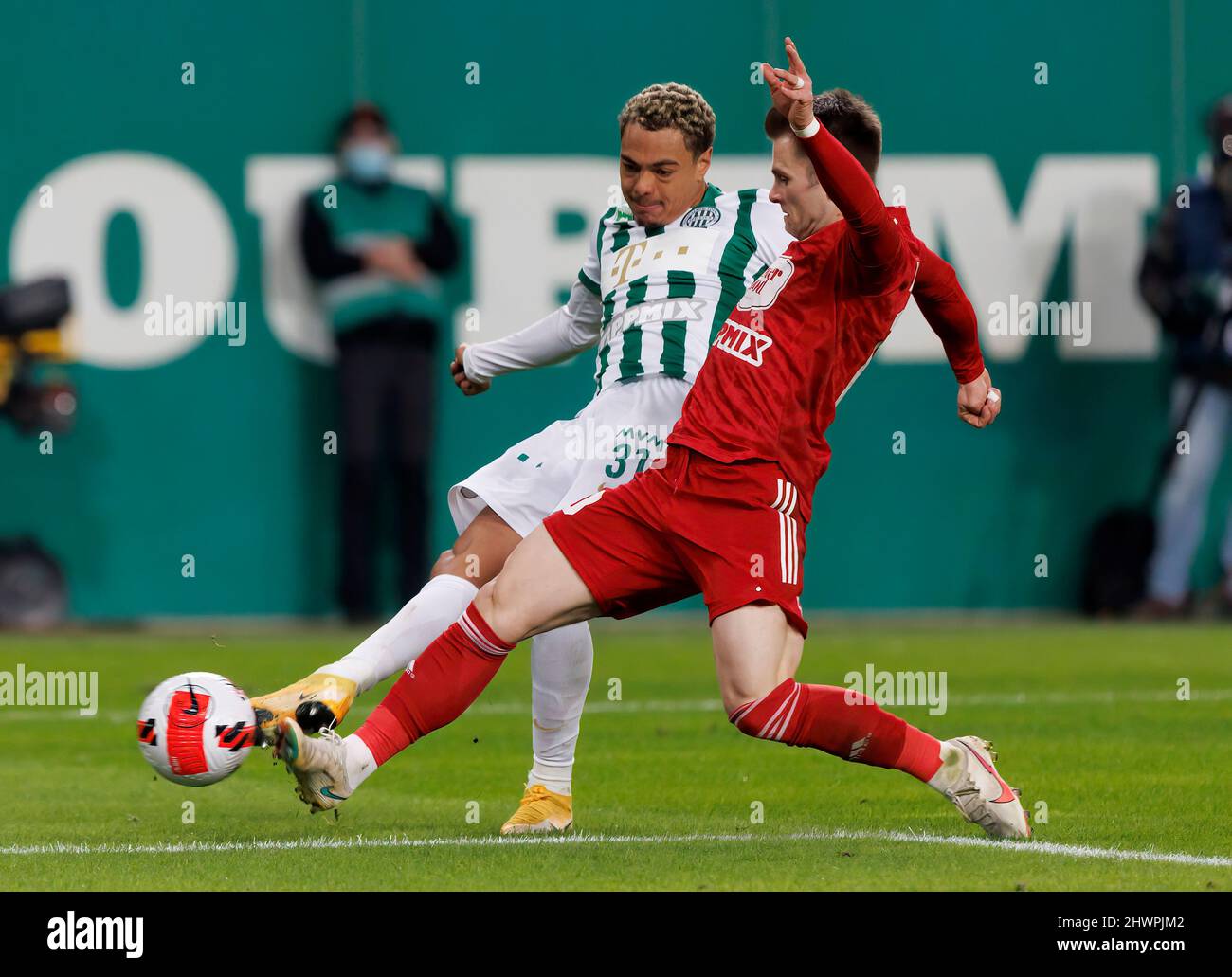 BUDAPEST, HUNGARY - MARCH 6: Claudiu Bumba of Kisvarda Master Good  challenges Henry Wingo of Ferencvarosi TC during the Hungarian OTP Bank  Liga match between Ferencvarosi TC and Kisvarda Master Good at