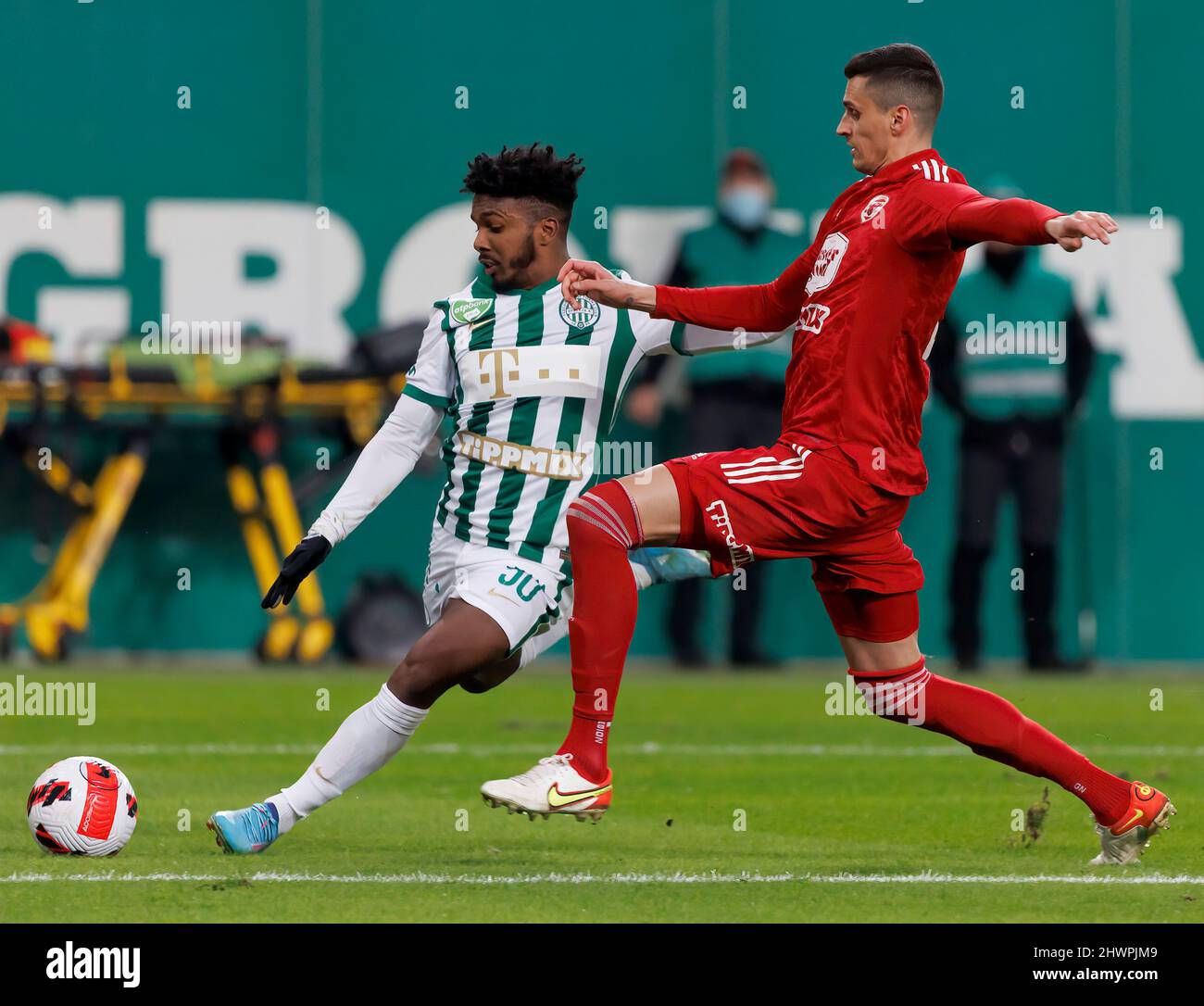 BUDAPEST, HUNGARY - MARCH 6: Claudiu Bumba of Kisvarda Master Good  challenges Henry Wingo of Ferencvarosi TC during the Hungarian OTP Bank  Liga match between Ferencvarosi TC and Kisvarda Master Good at