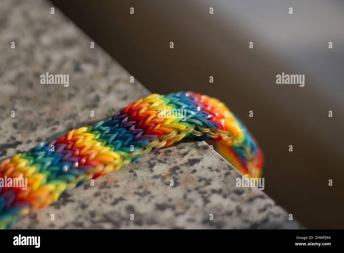 Rainbow bracelet made of elastic bands. Children's toy of all colors of