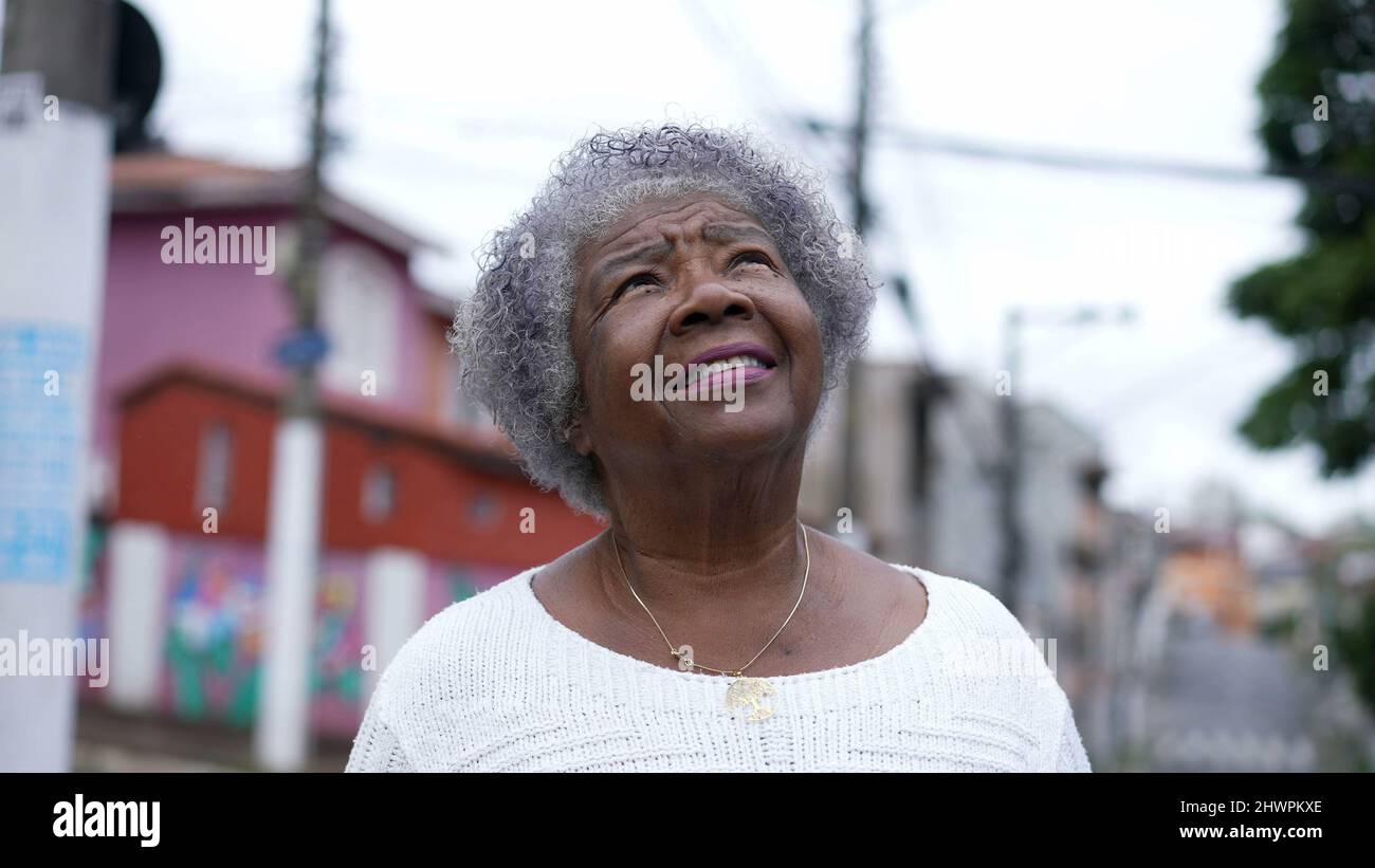 Old woman opening closing eyes hi-res stock photography and images - Alamy