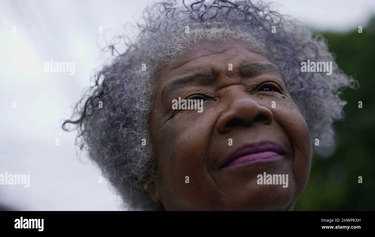 Old woman opening closing eyes hi-res stock photography and images - Alamy