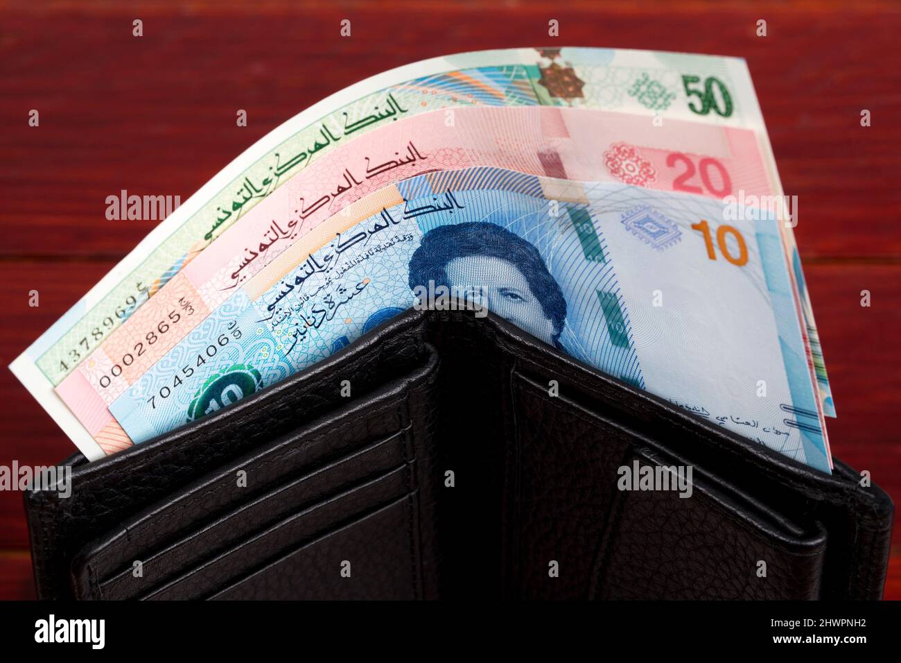 Tunisian money - dinar in the black wallet Stock Photo
