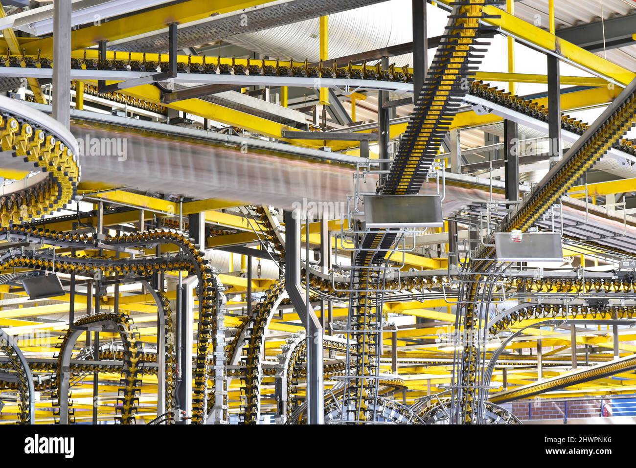 Conveyor belts with newspapers in a printing shop Stock Photo